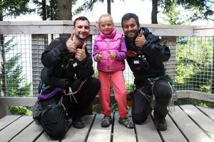 Ziptrek Ecotours guides (L) Kyle Thompson-Connell and (R) Arjun Thakkar with Cara Quinn (middle).